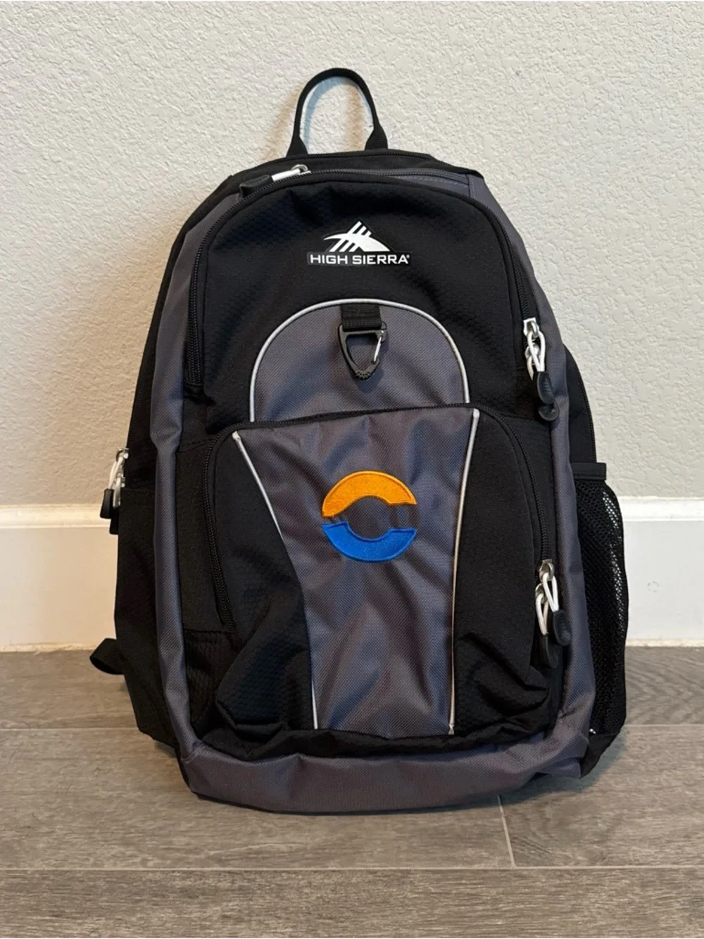 High Sierra Black and Gray Backpack with Blue and Orange Logo